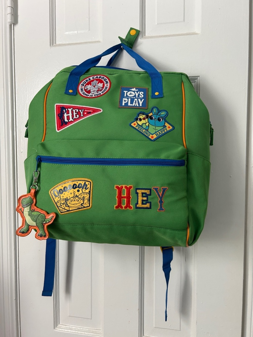 Disney Green Backpack with Blue Accents and Multicolor Patches